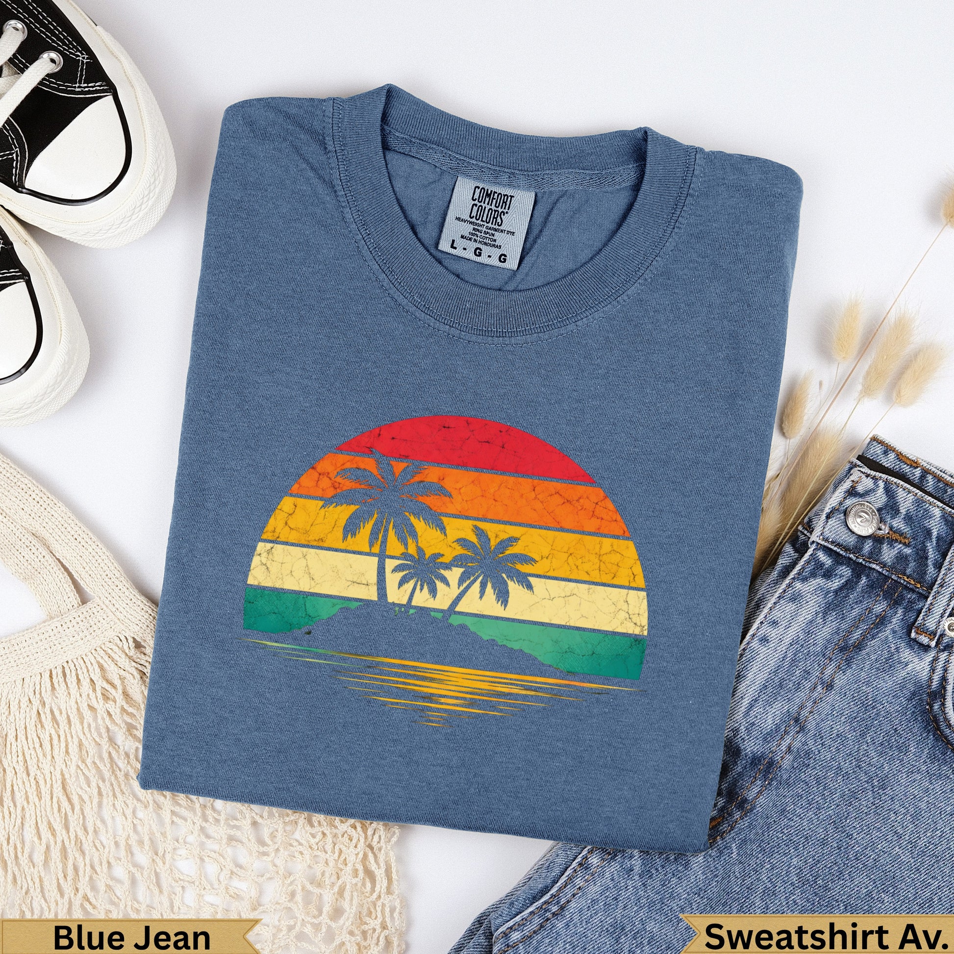 Blue Jean Comfort Colors sweatshirt with a vintage sunset beach graphic.