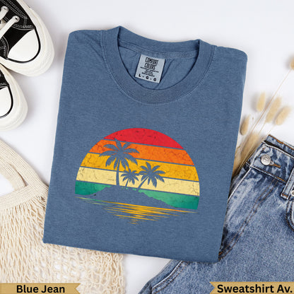 Blue Jean Comfort Colors sweatshirt with a vintage sunset beach graphic.