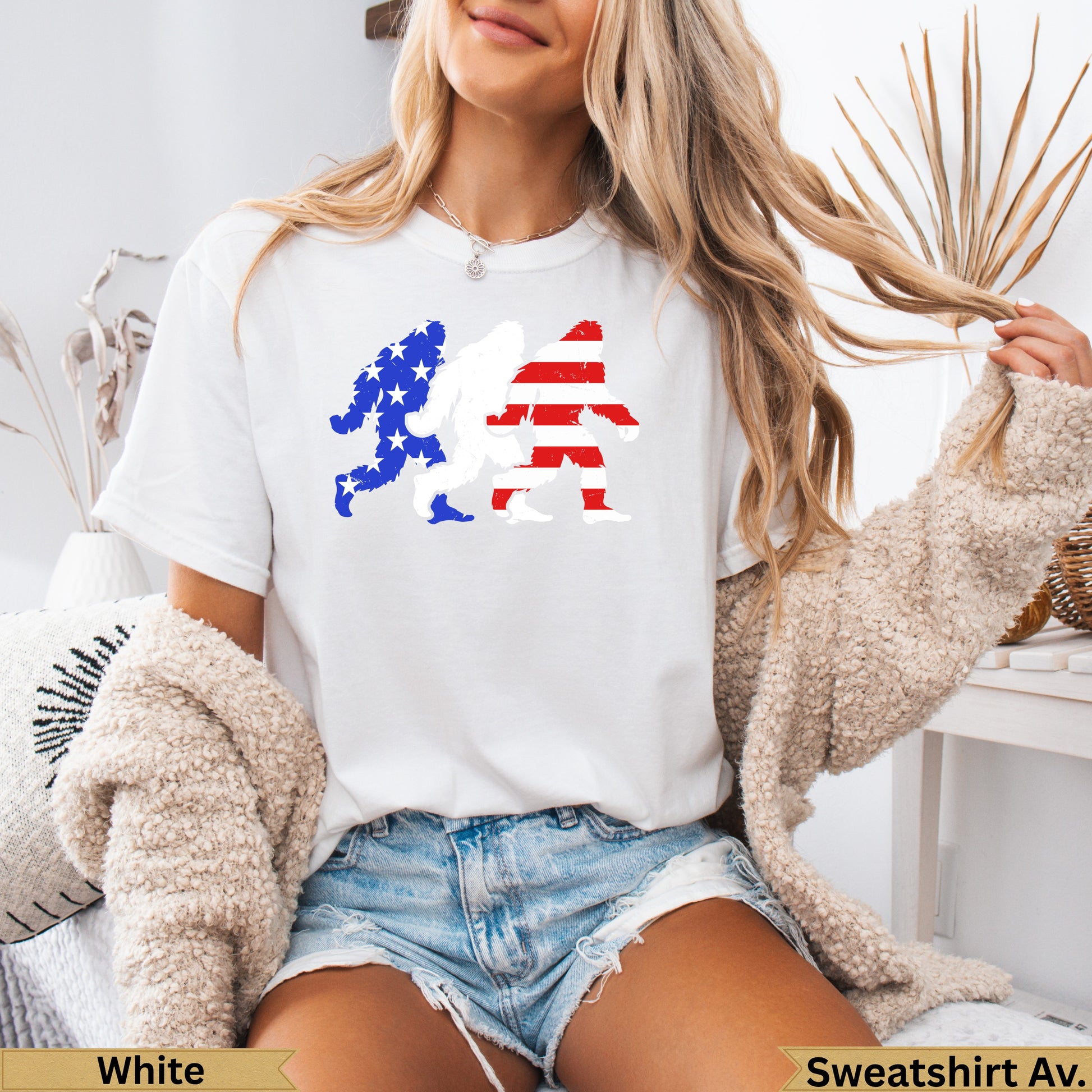 White t-shirt with red and blue USA flag Bigfoot graphic.