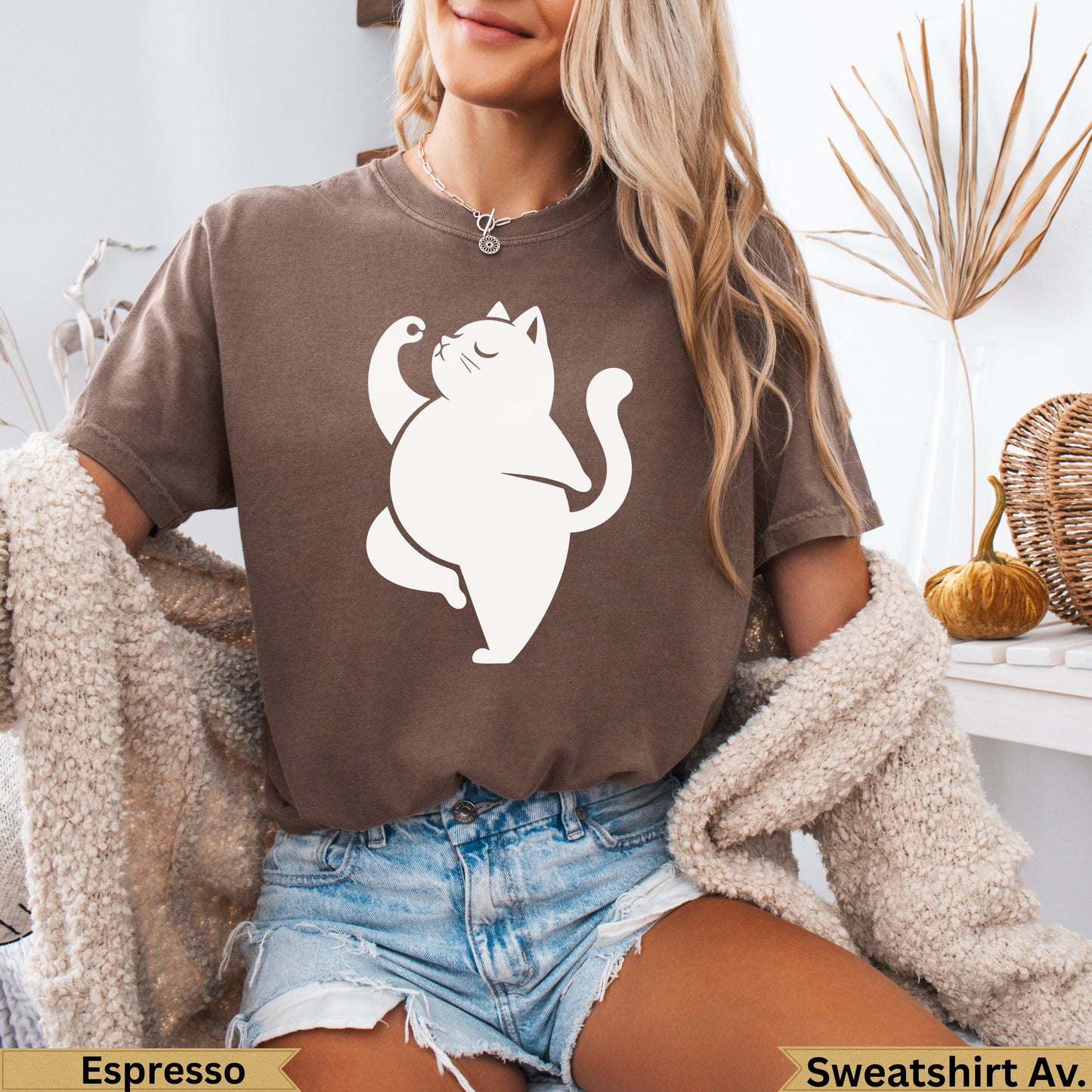 Brown crewneck sweatshirt with a white cat doing yoga pose.
