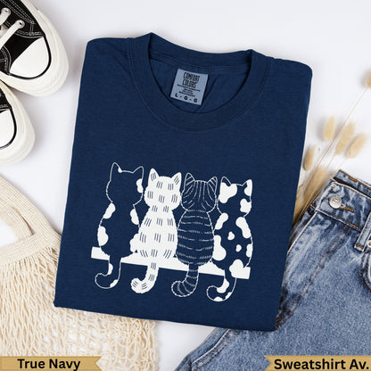 Navy sweatshirt with four white cat silhouettes across the chest.