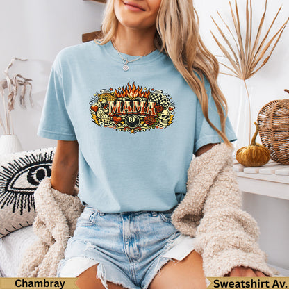Light blue t-shirt with "Mama" in fiery letters and billiards, skull, and checkered flag graphics.