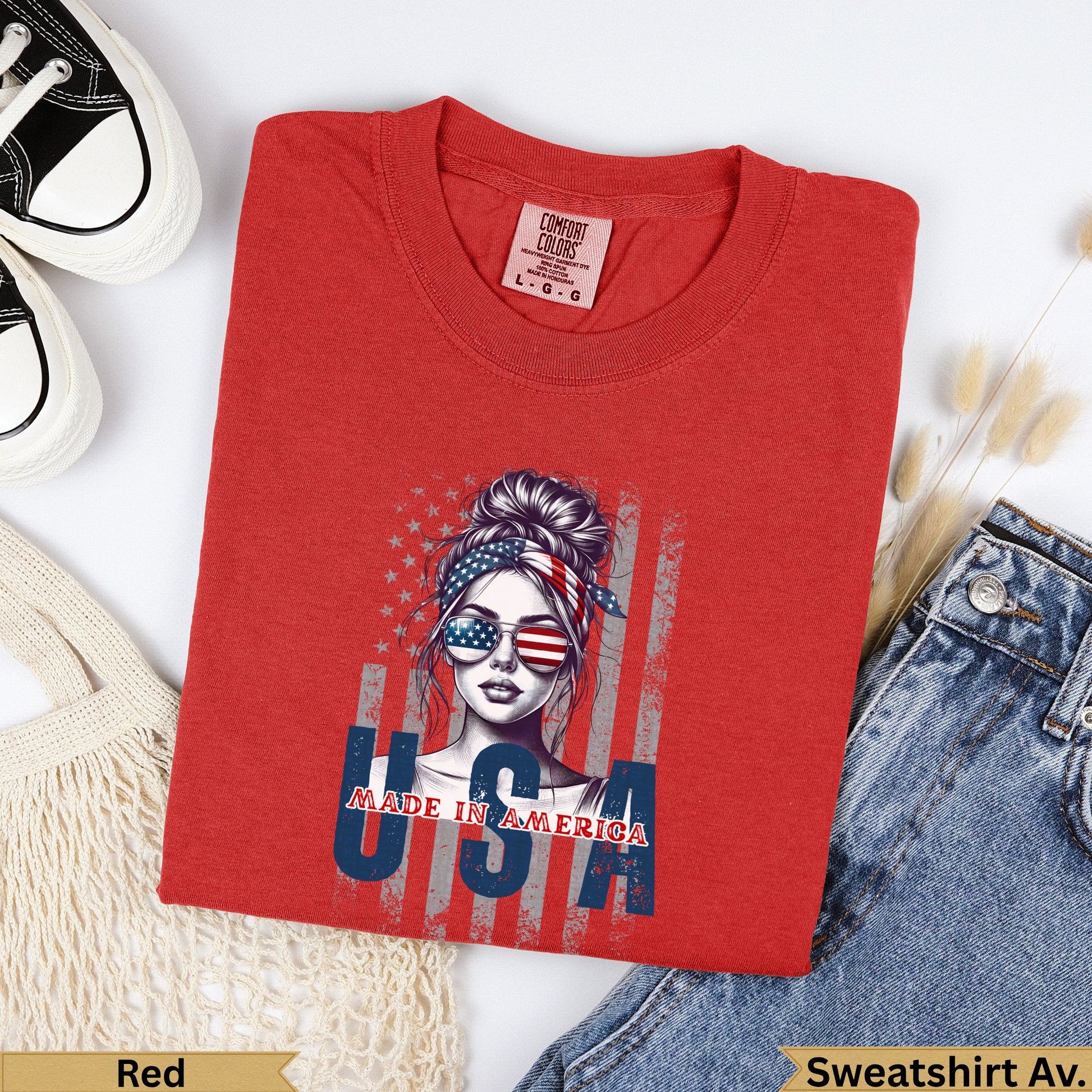 Red crewneck sweatshirt with "USA" and American flag styled woman graphic.