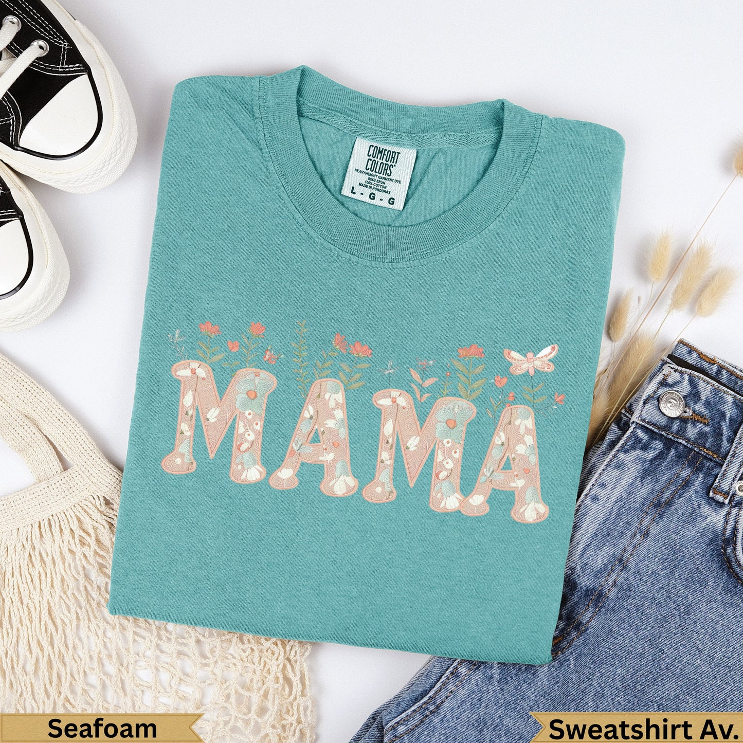 Teal Comfort Colors "MAMA" sweatshirt with floral accents.