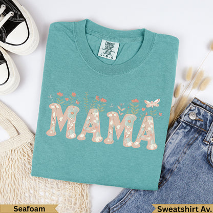 Teal Comfort Colors "MAMA" sweatshirt with floral accents.