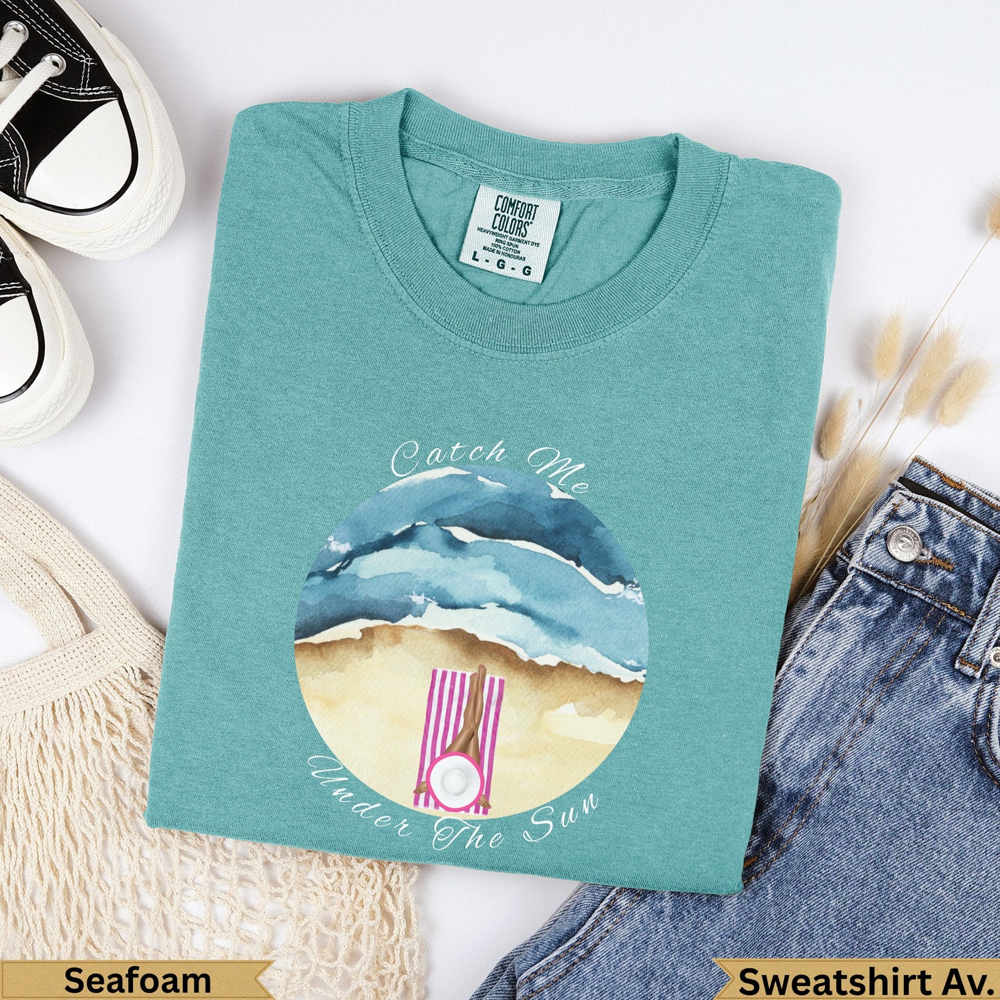 Seafoam Comfort Colors sweatshirt with "Catch Me Under the Sun" beach graphic.