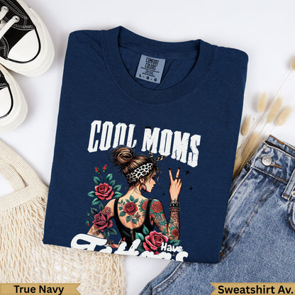 Navy crewneck sweatshirt with "COOL MOMS Have" text and tattooed woman graphic.