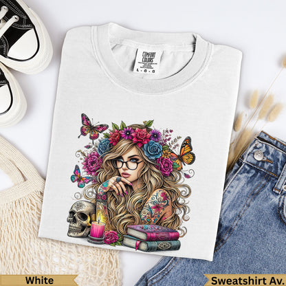 Woman with colorful floral headdress, butterflies, and books on a white t-shirt.