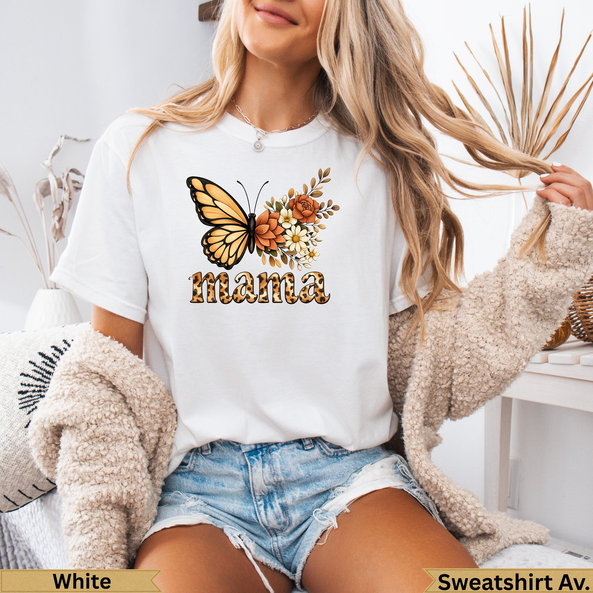 White t-shirt with a butterfly and floral design, featuring the word "Mama".