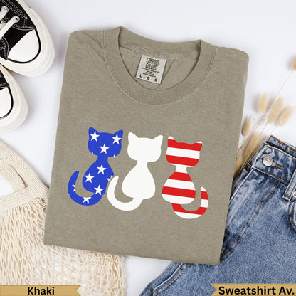 Khaki sweatshirt with three patriotic cats: blue with stars, white, and red striped.