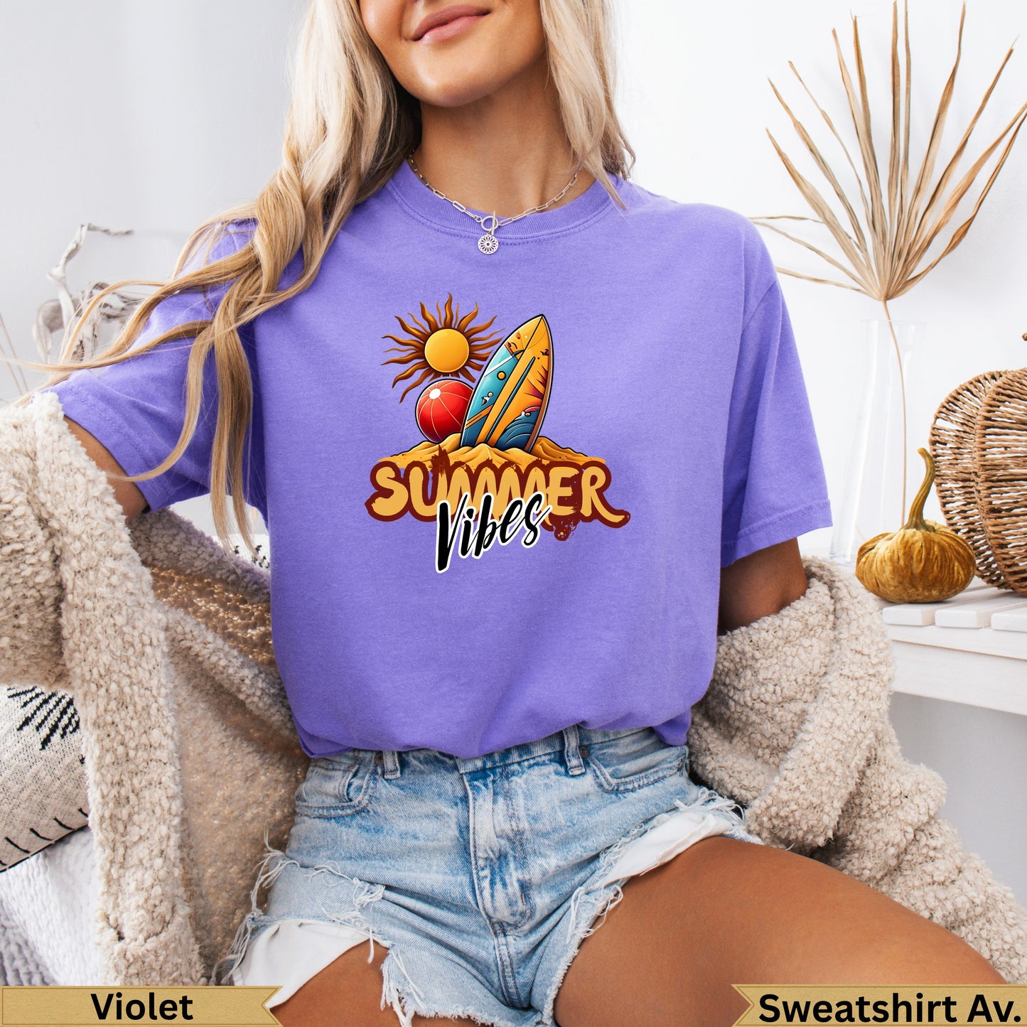 Purple t-shirt with "Summer Vibes" text, sun, surfboard, and beach graphic.