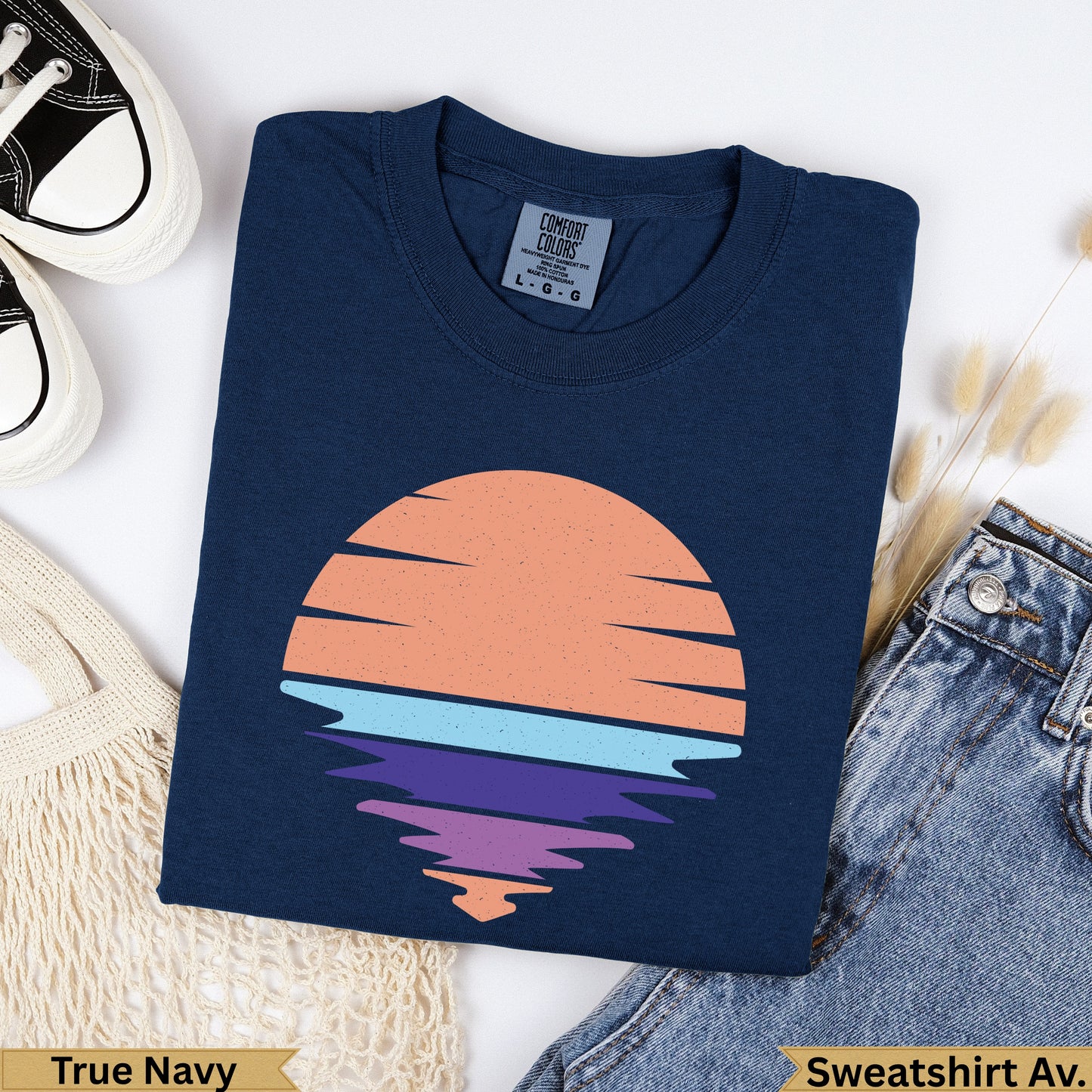 Navy t-shirt with retro sunset graphic and "True Navy" label.