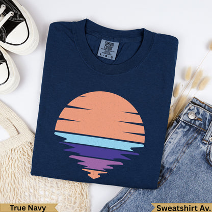 Navy t-shirt with retro sunset graphic and "True Navy" label.