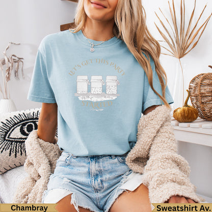 Light blue t-shirt with "Let's Get This Party Started" text and jar graphics.