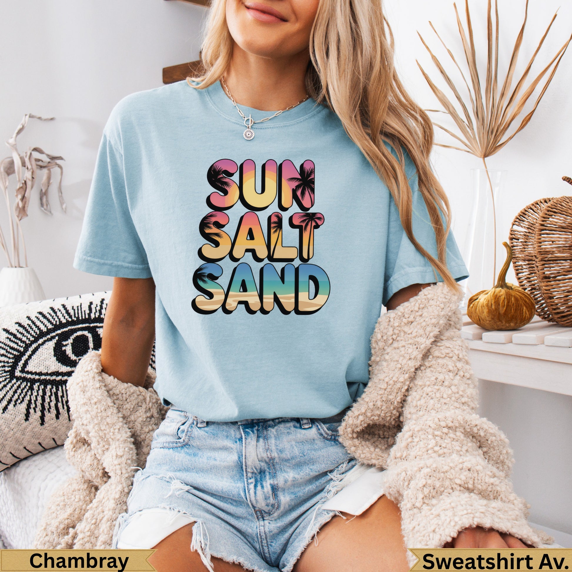 Light blue t-shirt with "Sun Salt Sand" and palm tree graphic.