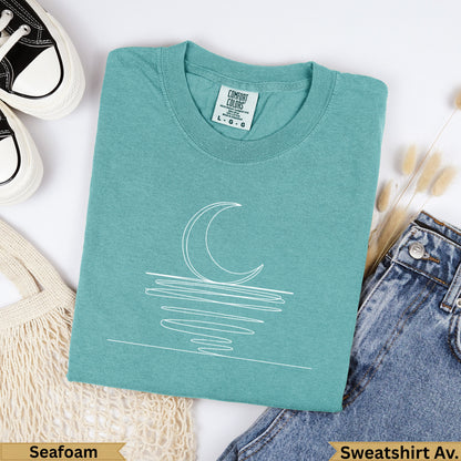 Teal Comfort Colors sweatshirt with white crescent moon line art, "Seafoam" text.