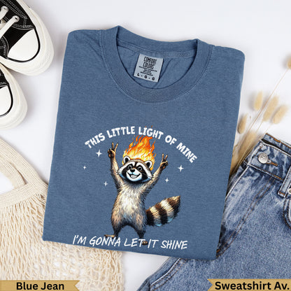 Blue Jean t-shirt with raccoon graphic and text: "This Little Light of Mine I'm Gonna Let It Shine."