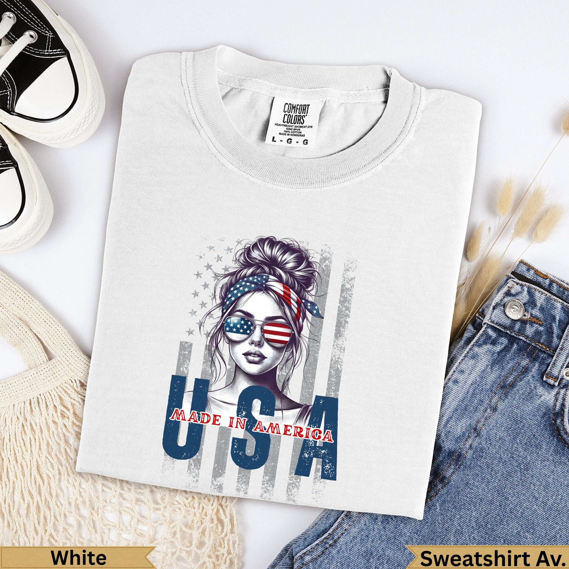 White USA graphic sweatshirt with woman wearing sunglasses and bandana.