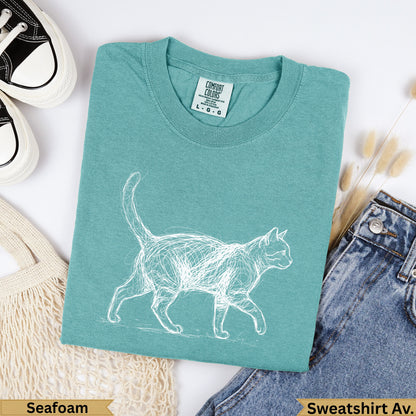 Teal t-shirt with a white sketch of a cat, "Seafoam" and "Sweatshirt Av." labels.