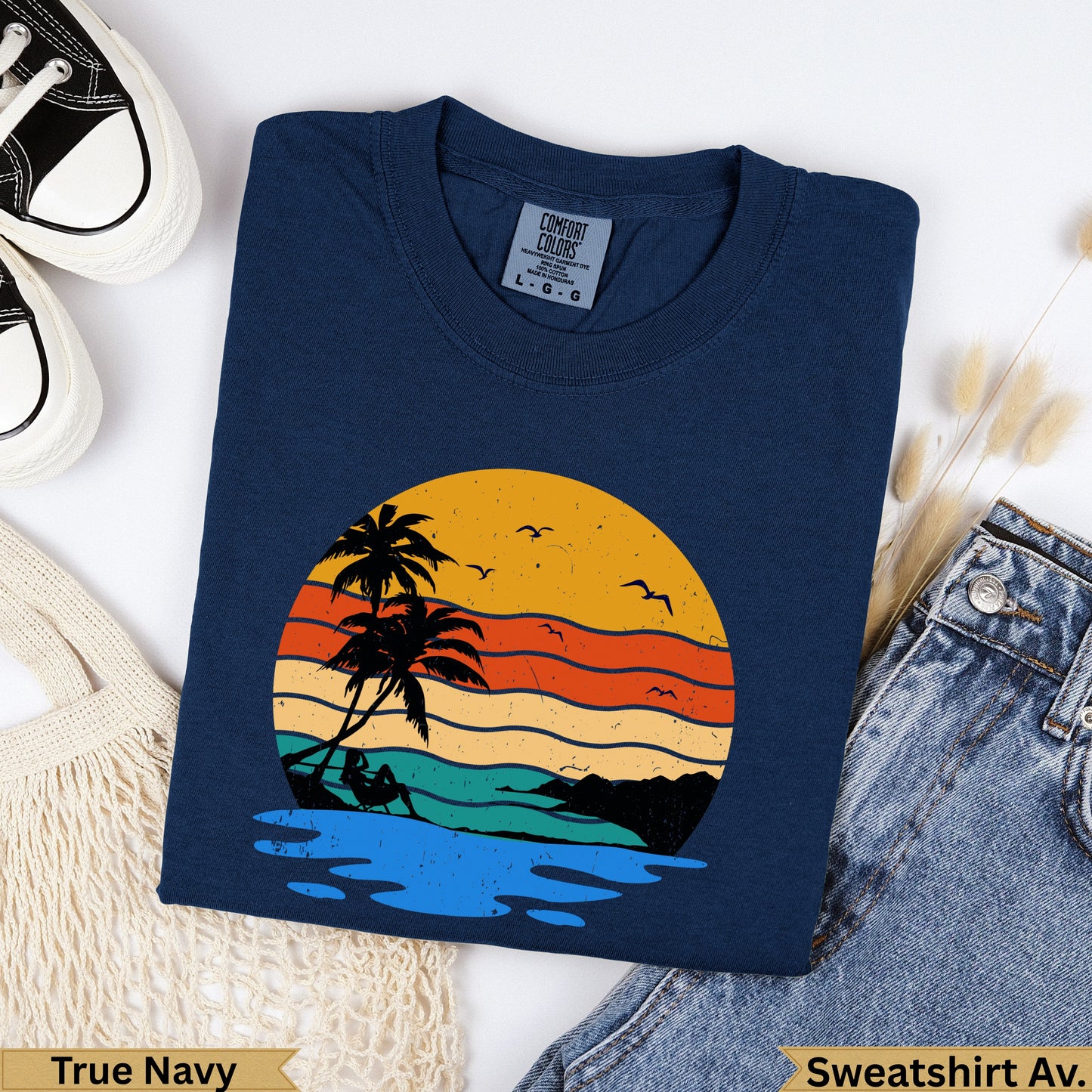 Navy crewneck sweatshirt with vintage sunset graphic.