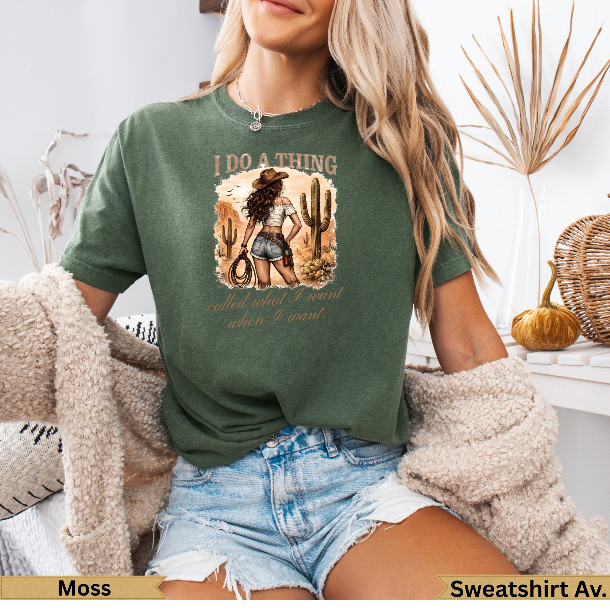 Green graphic t-shirt with desert scene and text "I DO A THING called what I want when I want."