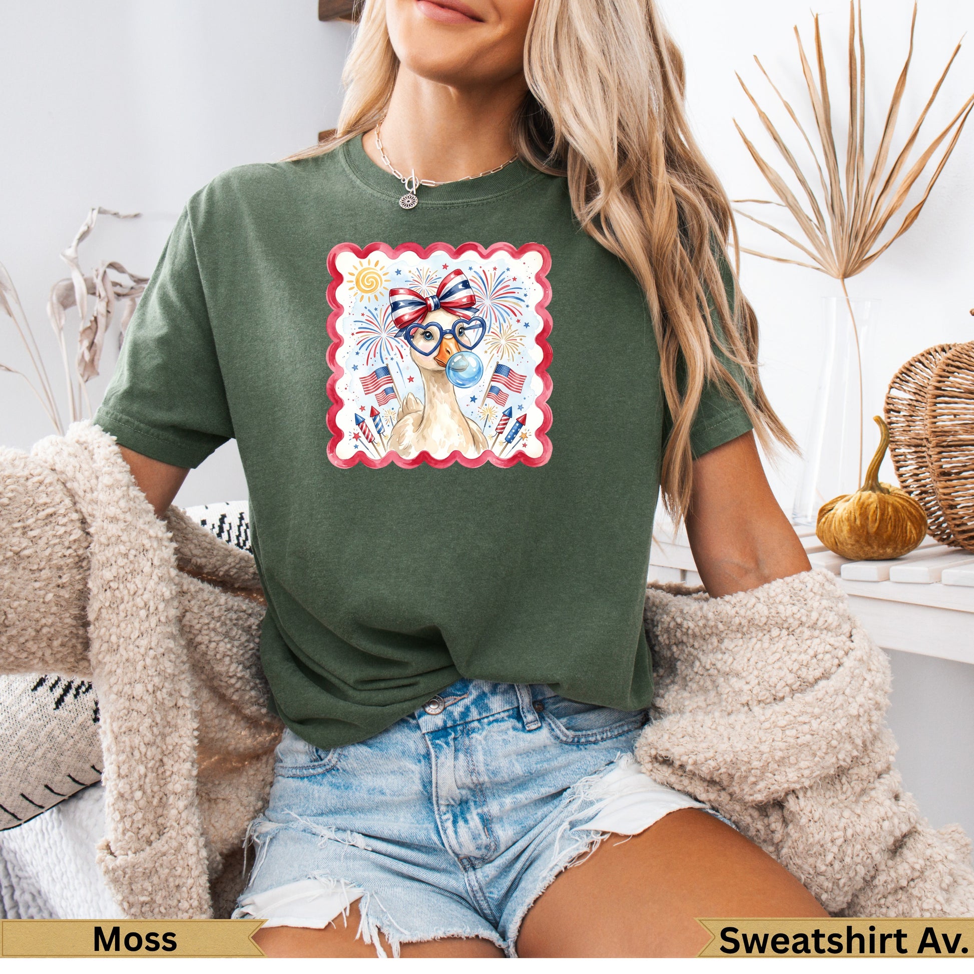Green t-shirt with patriotic llama graphic and fireworks.