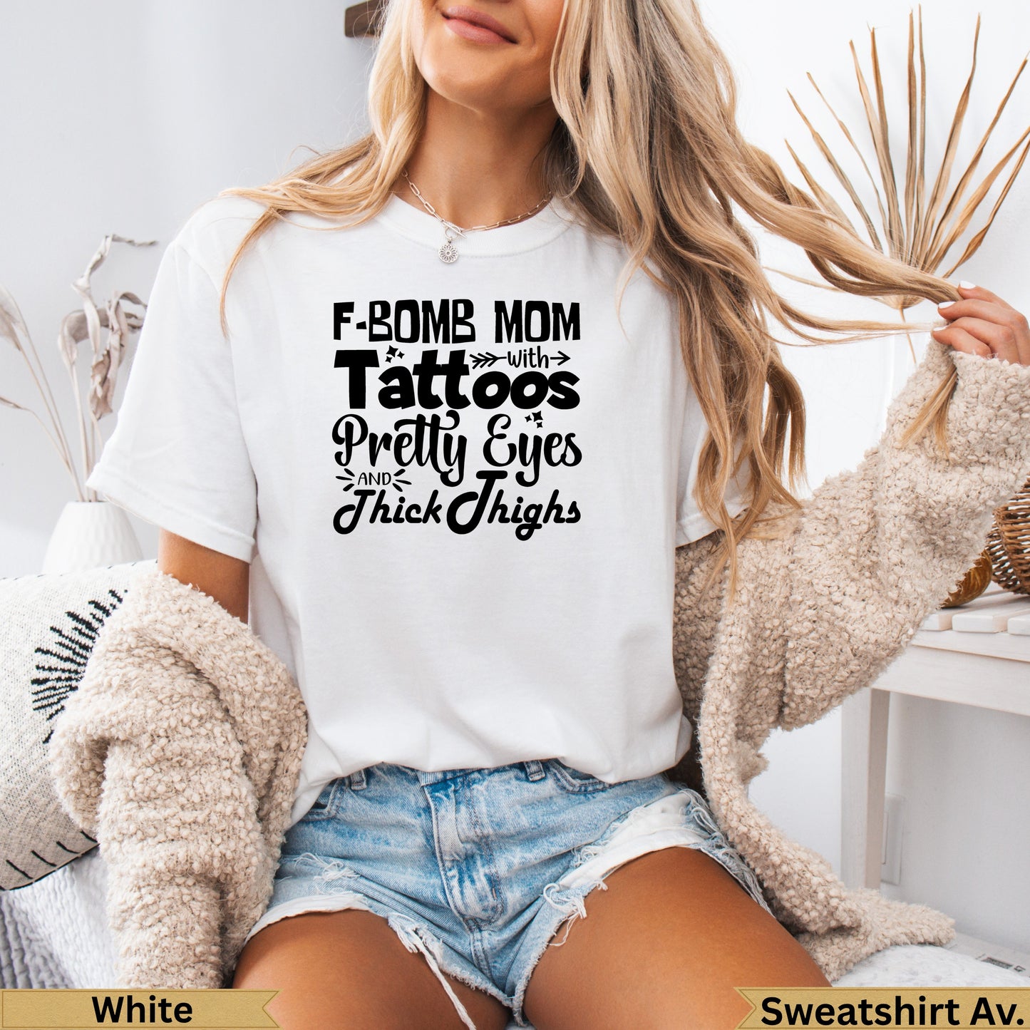 White t-shirt with text "F-Bomb Mom with Pretty Eyes and Thick Thighs".