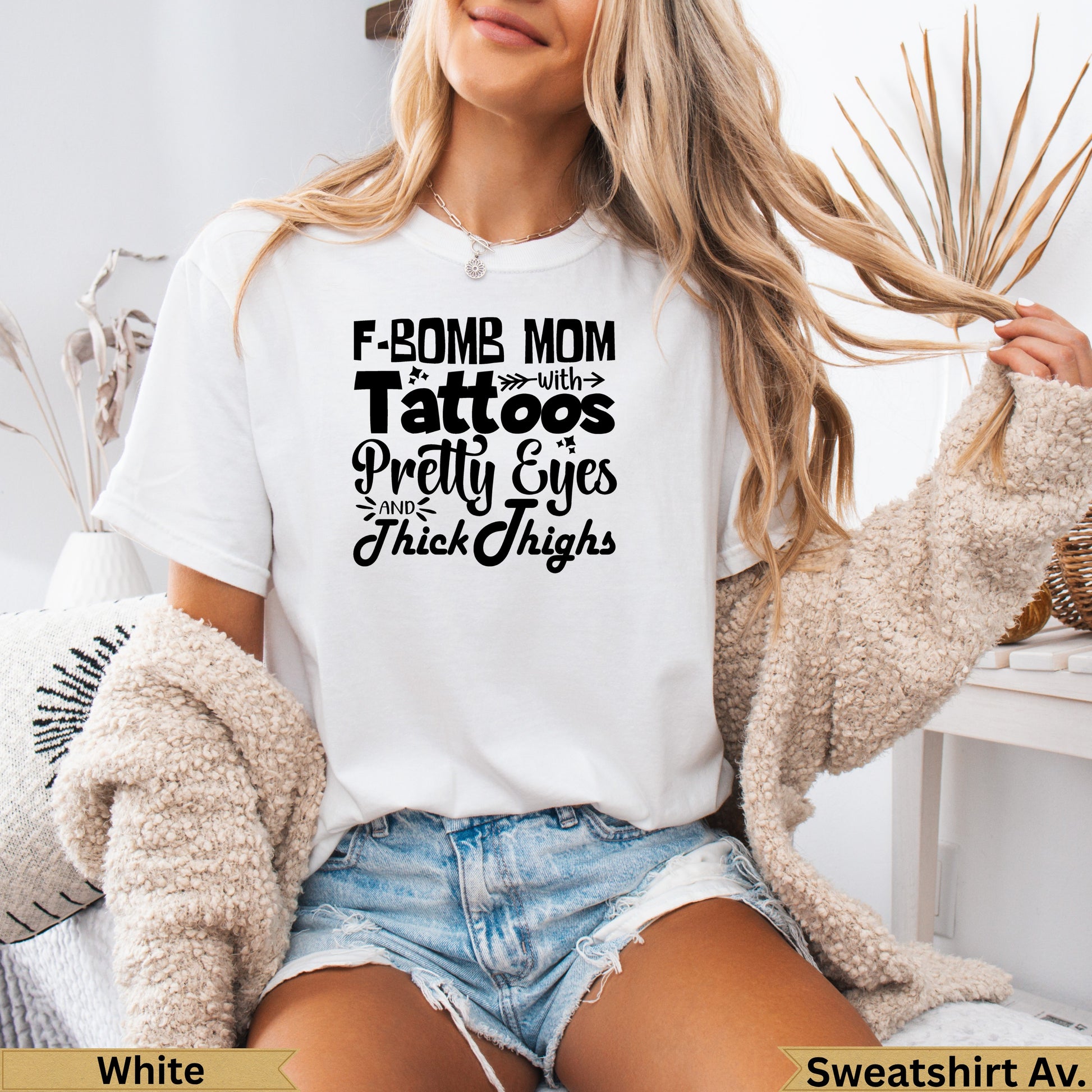 White t-shirt with text "F-Bomb Mom with Pretty Eyes and Thick Thighs".