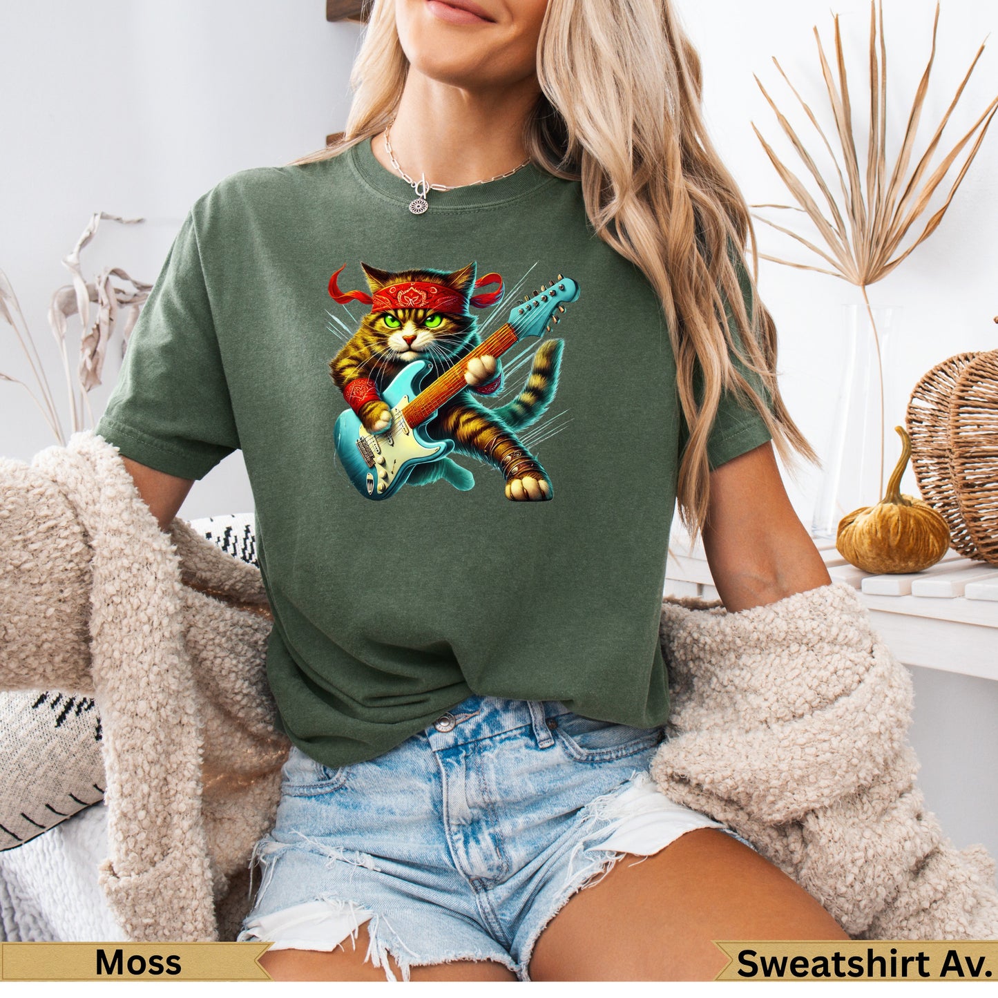 T-shirt graphic of a cool cat wearing a bandana, playing a red electric guitar.