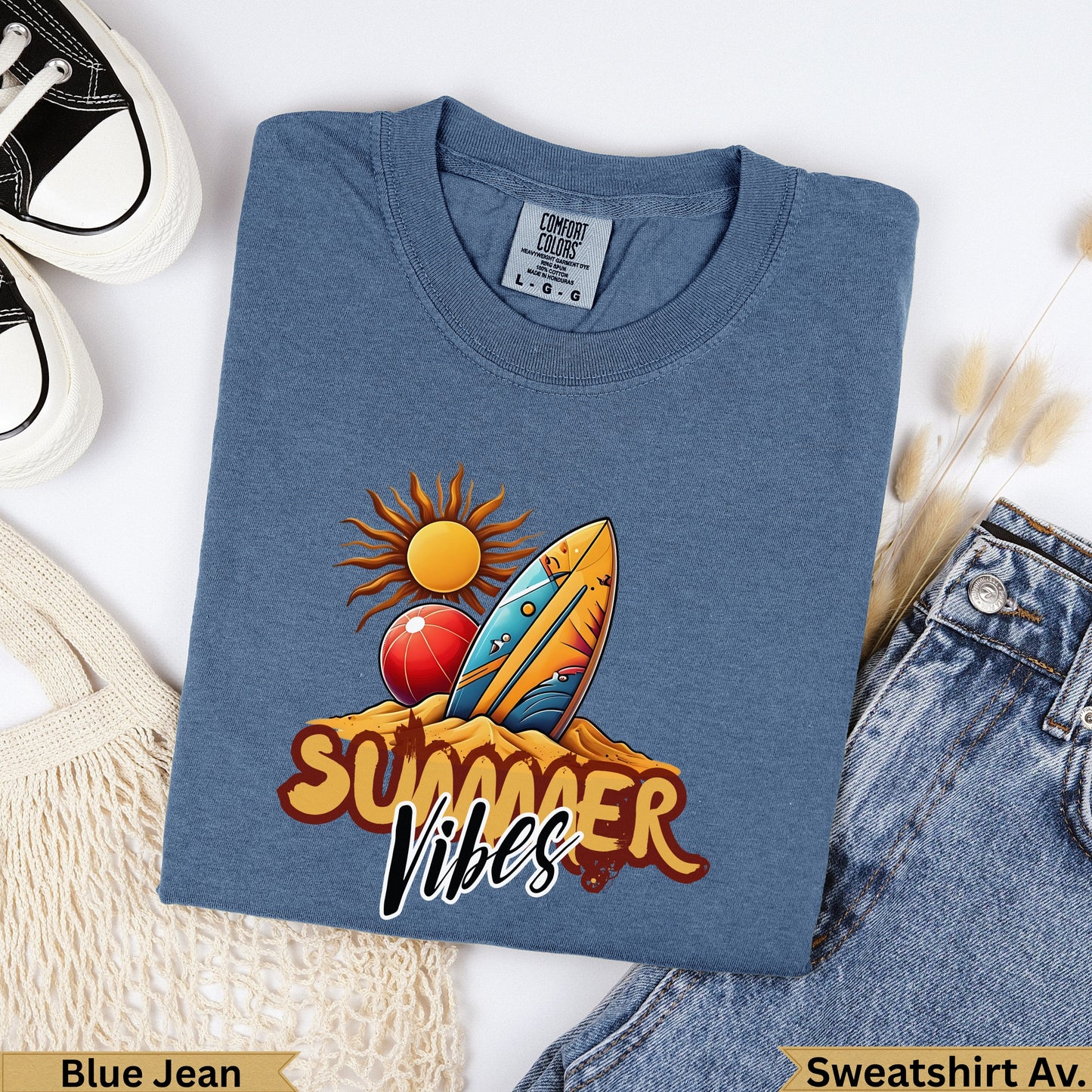 Blue t-shirt with "Summer Vibes" text, surf board, and beach ball design.