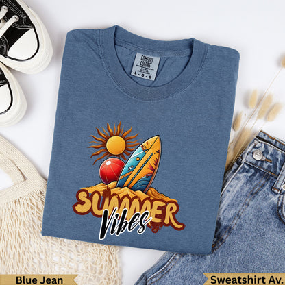 Blue t-shirt with "Summer Vibes" text, surf board, and beach ball design.