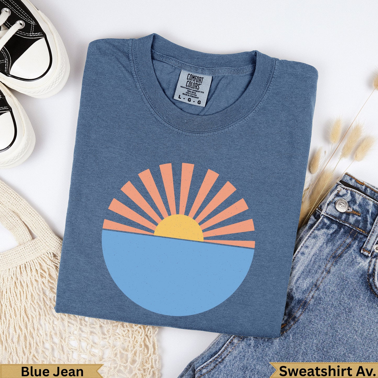 Blue Jean Comfort Colors sweatshirt with a stylized sun over water graphic.