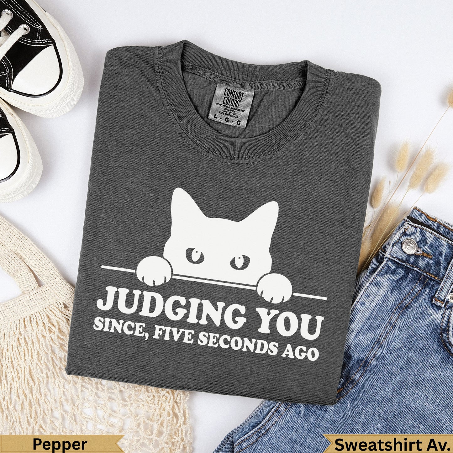 Dark grey t-shirt with white cat graphic and "Judging you since, five seconds ago" text.