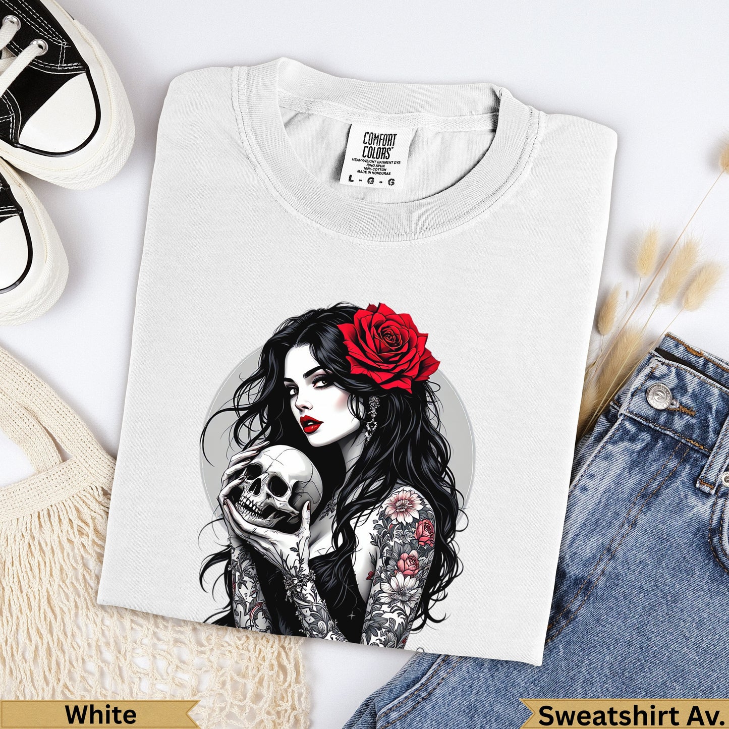 White t-shirt with tattoo art of woman holding skull and red rose.