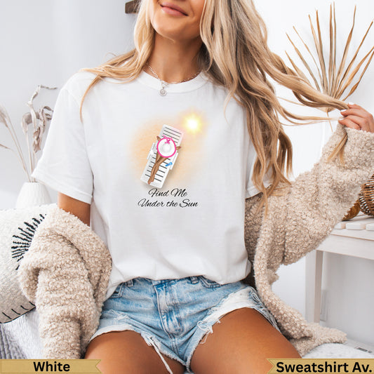 White t-shirt with "Find Me Under the Sun" text and a lounge chair graphic.