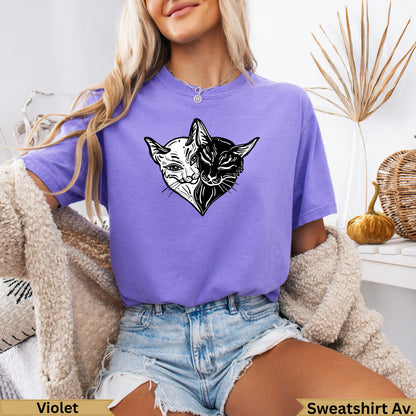 Purple t-shirt with a yin-yang cat design.