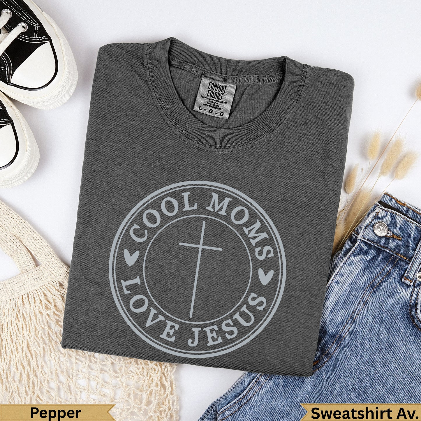 Dark gray t-shirt with "Cool Moms Love Jesus" circular graphic and cross.