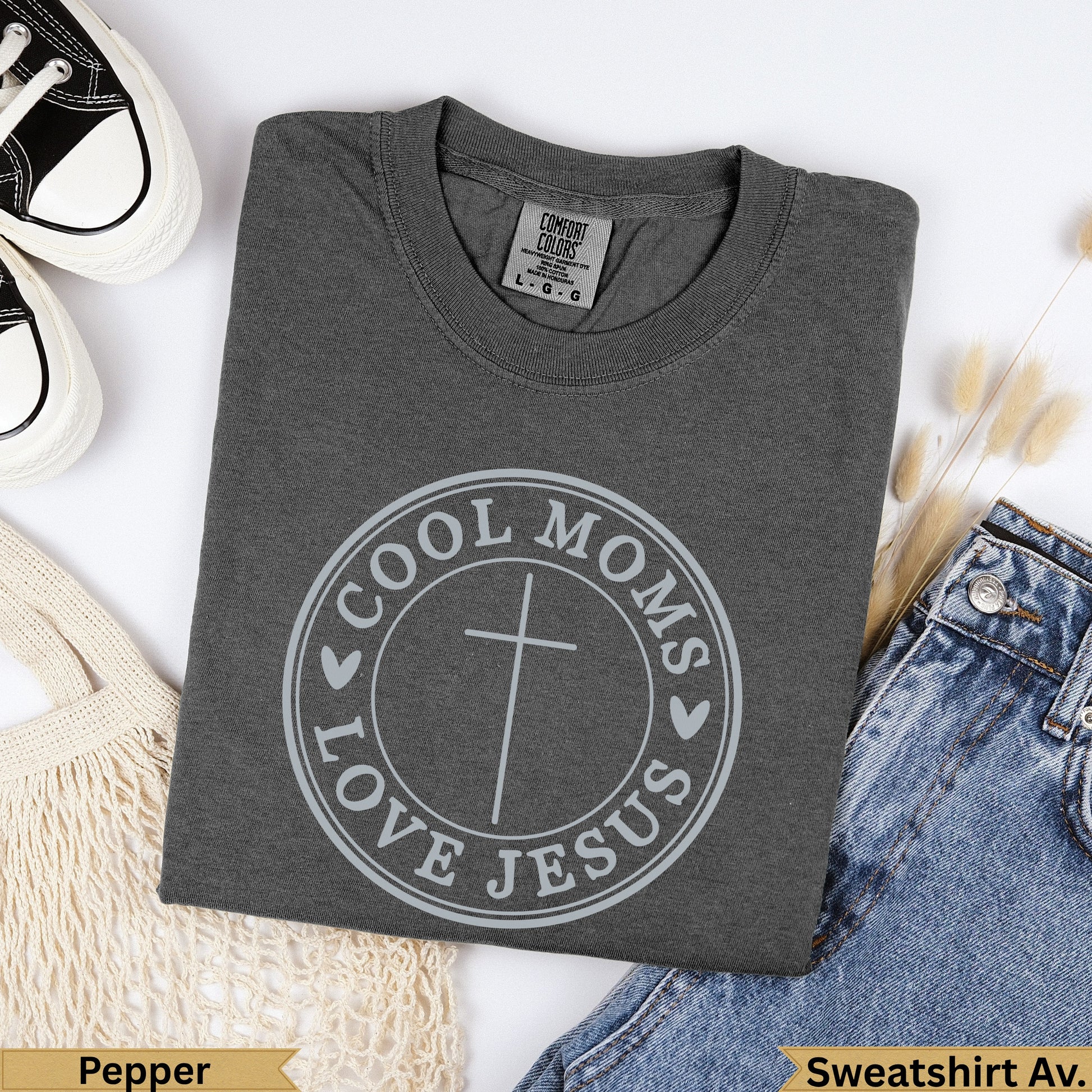 Dark gray t-shirt with "Cool Moms Love Jesus" circular graphic and cross.