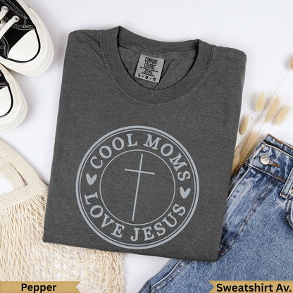 Dark gray t-shirt with "Cool Moms Love Jesus" circular graphic and cross.