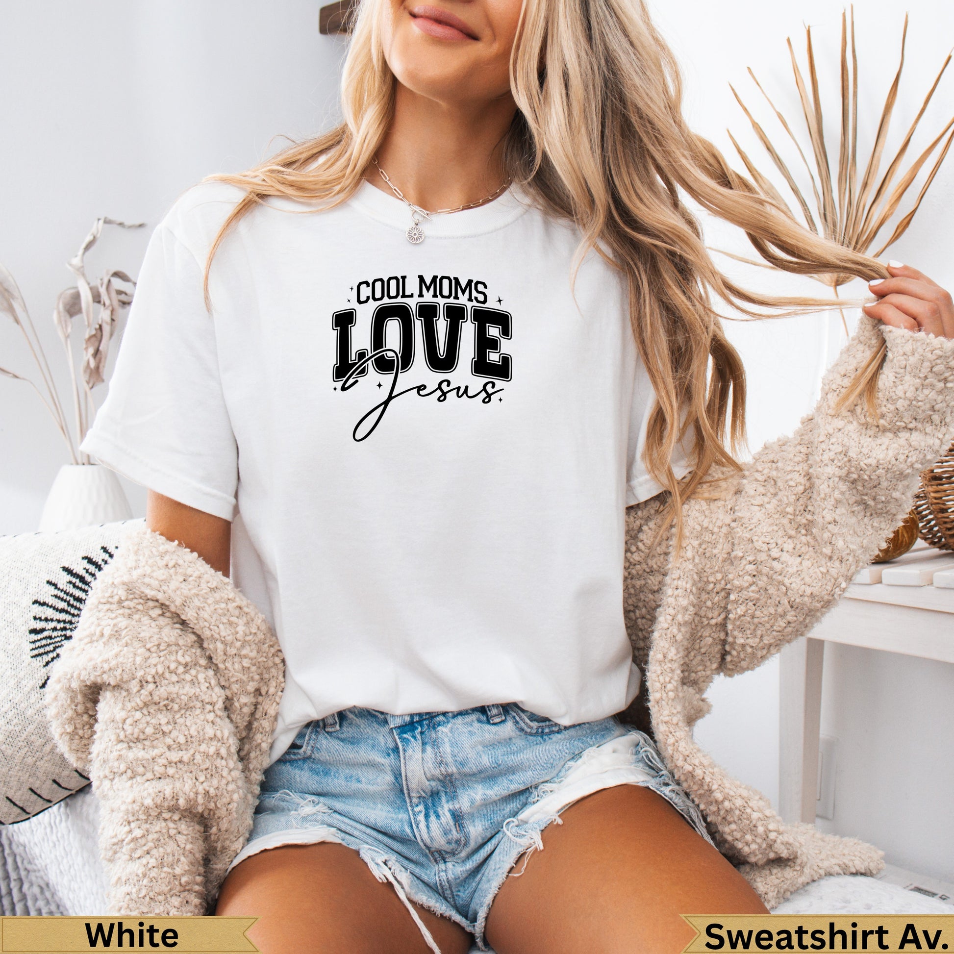 White crewneck sweatshirt with "COOL MOMS LOVE Jesus" text.