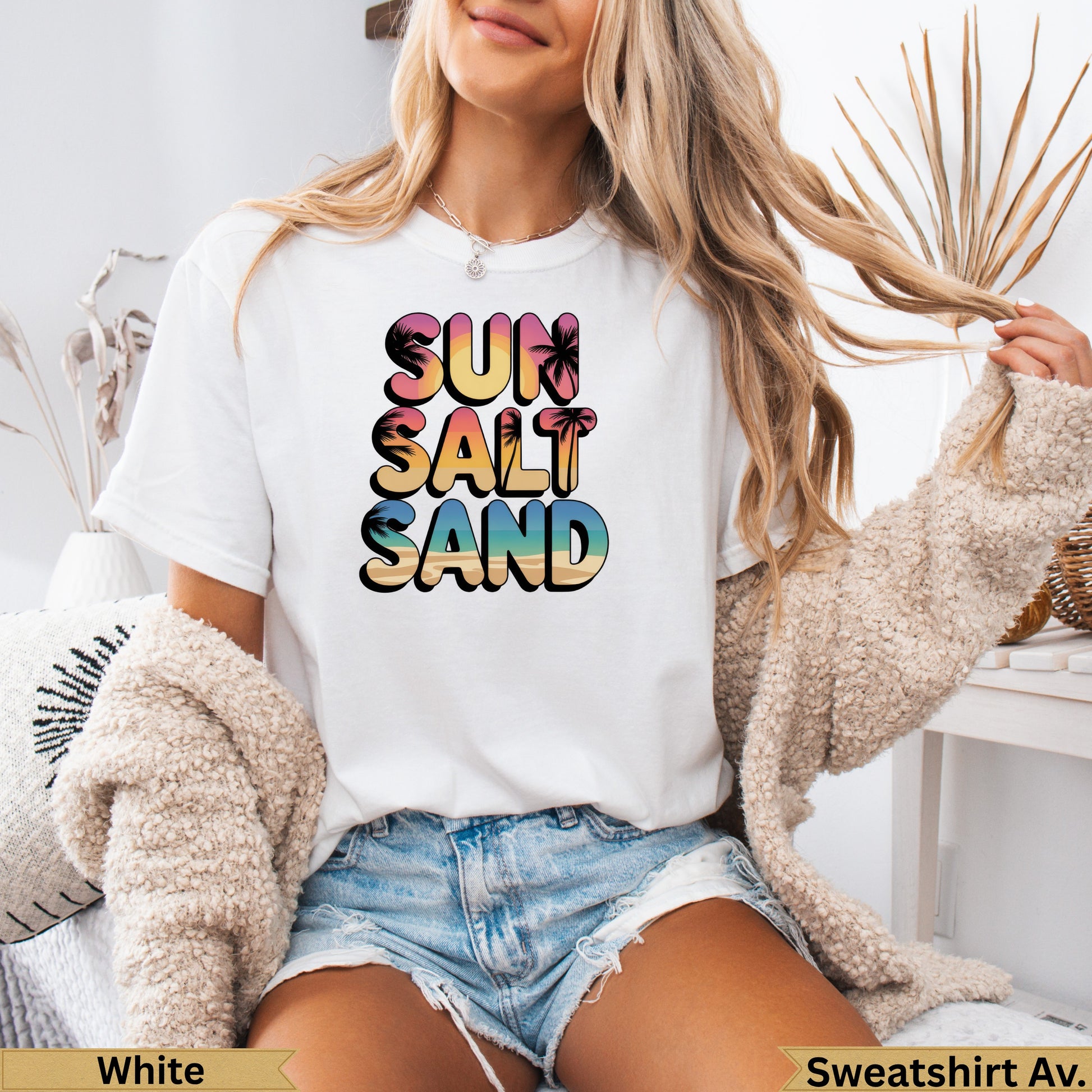 White t-shirt with "Sun Salt Sand" graphic and palm trees.