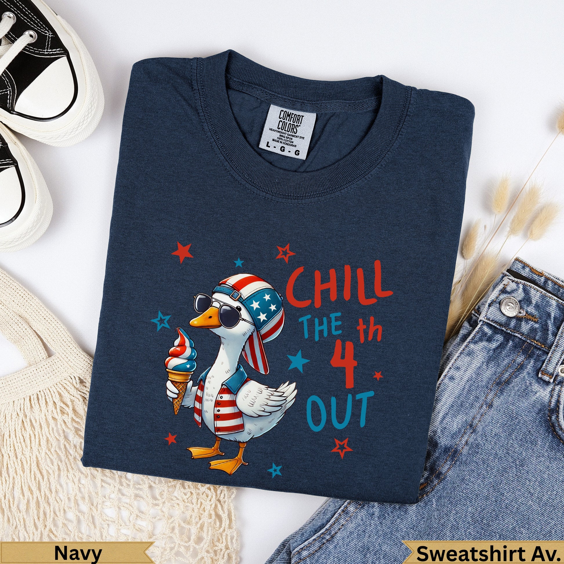 Navy sweatshirt with a cartoon duck in a cone hat, sunglasses, and ice cream.