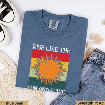Blue Jean sweatshirt with "Rise Like the Sun and Shine" graphic.
