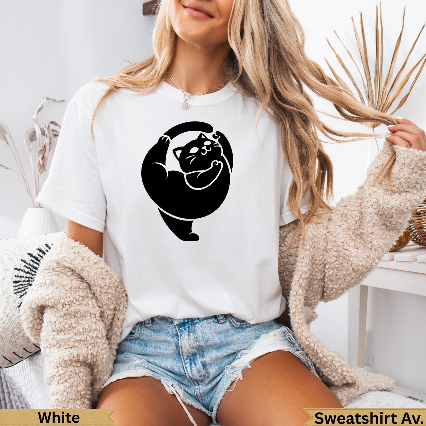 White t-shirt with black stylized cat graphic and "Sweatshirt Av." text.