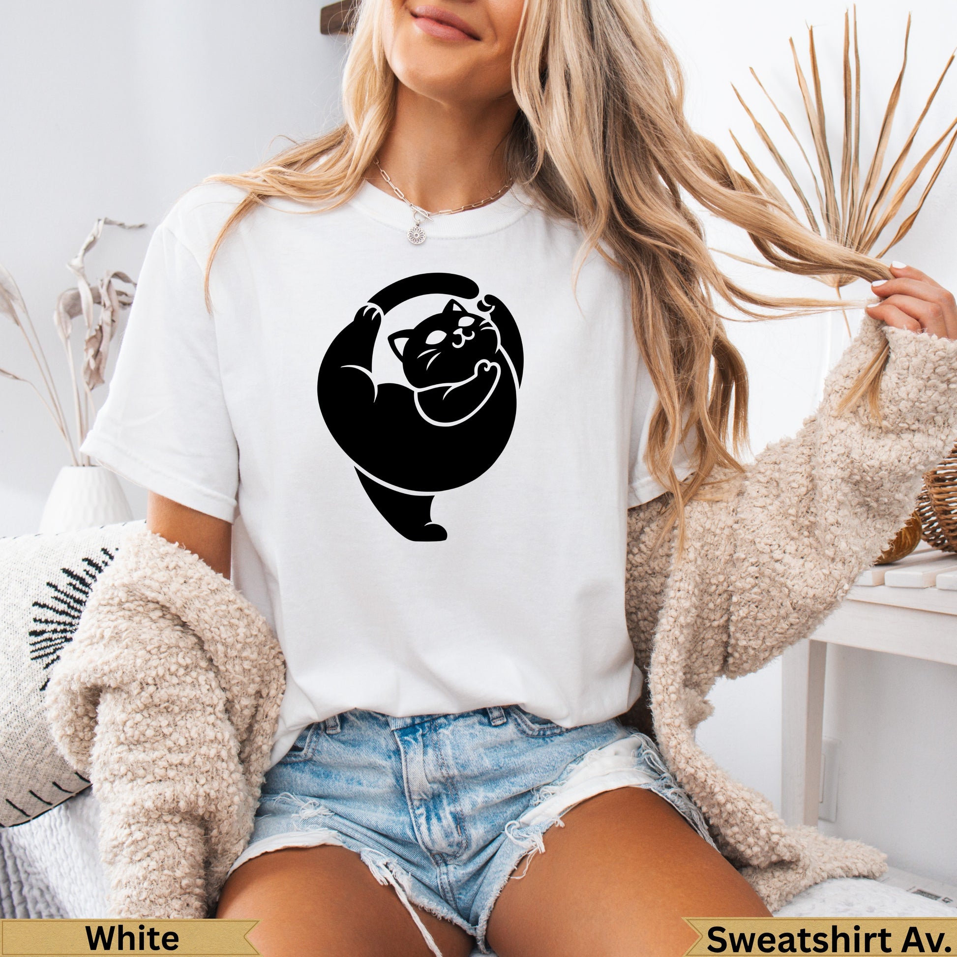 White t-shirt with black stylized cat graphic and "Sweatshirt Av." text.