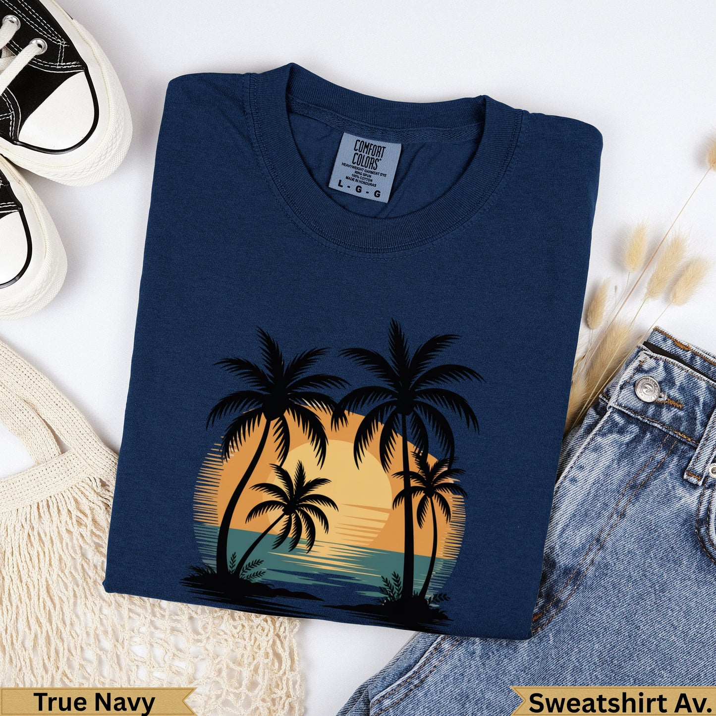 Navy blue crewneck sweatshirt with sunset and palm trees graphic, "True Navy" text.