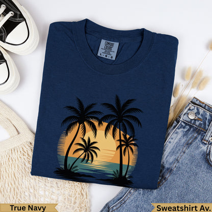 Navy blue crewneck sweatshirt with sunset and palm trees graphic, "True Navy" text.