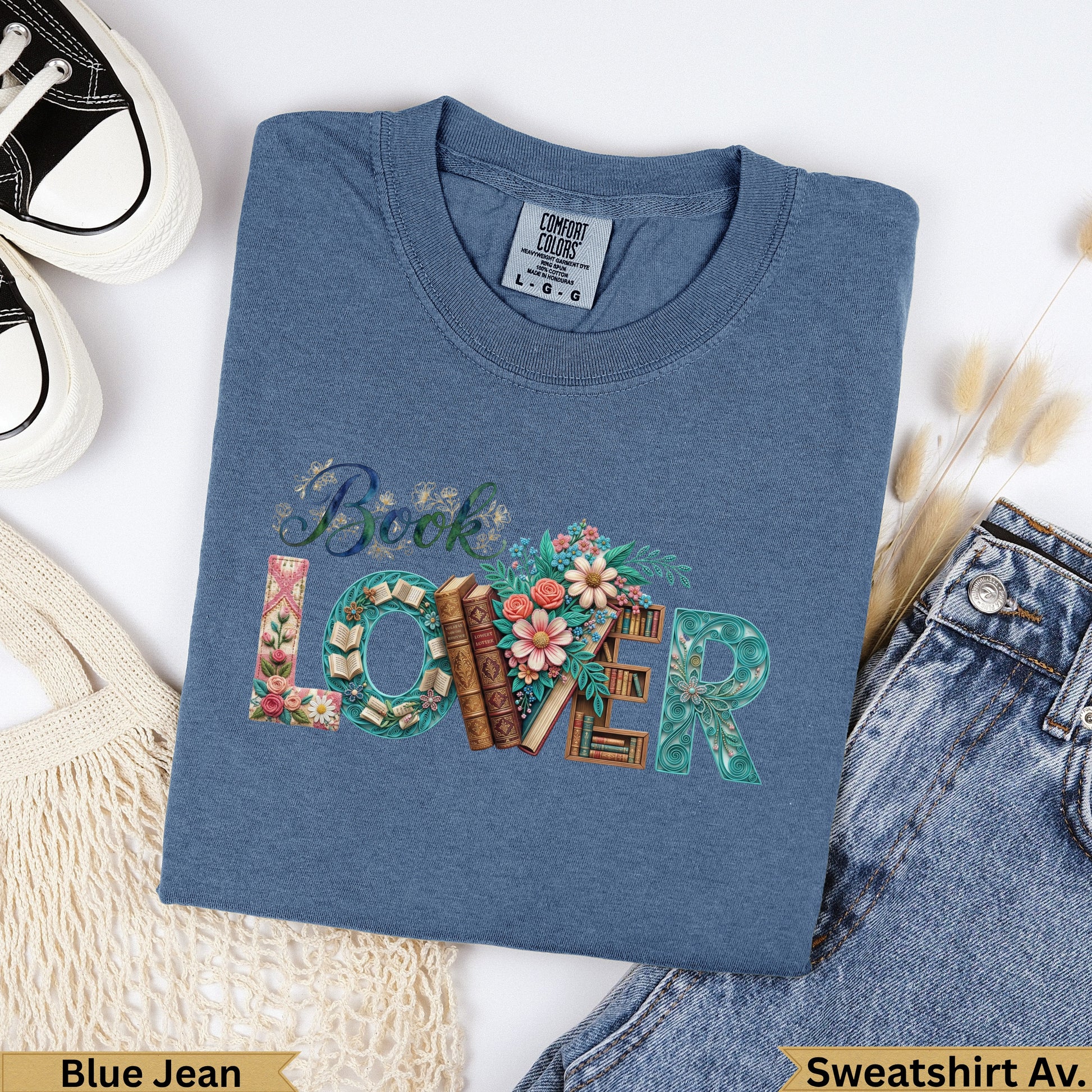 Blue t-shirt with "Book Lover" design featuring books and flowers.