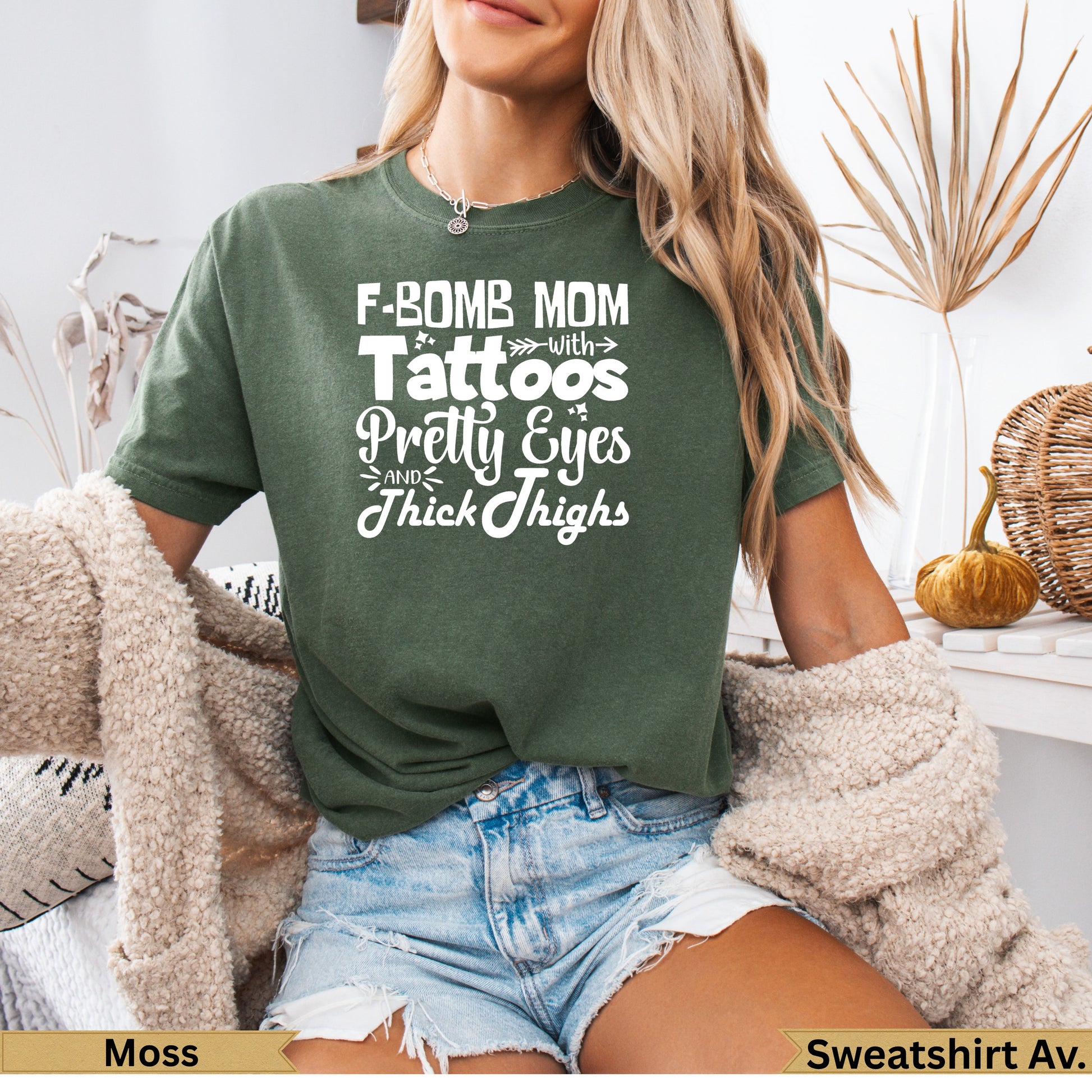 F-Bomb Mom with Tattoos Pretty Eyes Thick Thighs graphic tee in moss.