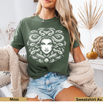 Green t-shirt with white Medusa graphic on the front.